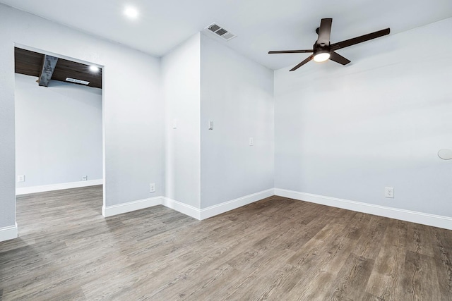 empty room featuring wood-type flooring and ceiling fan