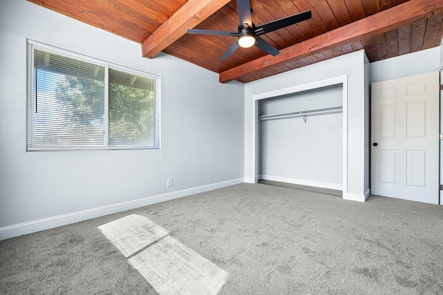 unfurnished bedroom featuring carpet floors, wood ceiling, beam ceiling, and ceiling fan