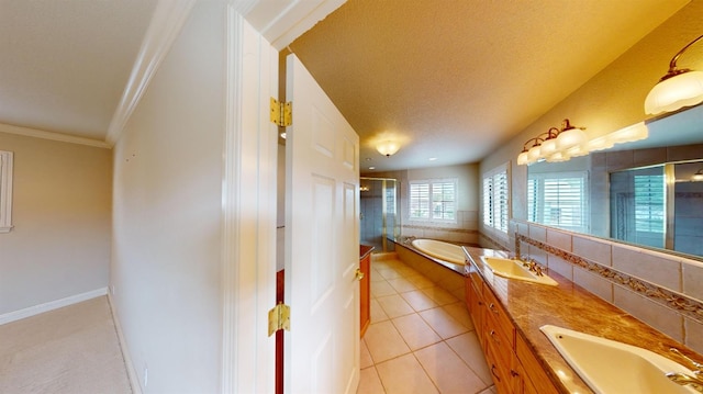 bathroom featuring tile patterned floors, a textured ceiling, independent shower and bath, and vanity