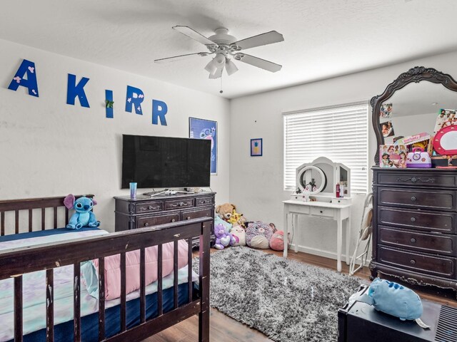 bedroom featuring ceiling fan and hardwood / wood-style floors