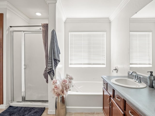 bathroom featuring shower with separate bathtub, tile patterned floors, vanity, and crown molding