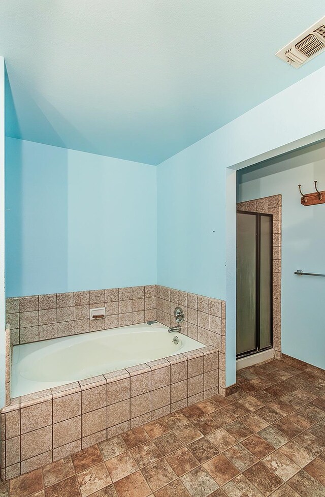 bathroom with shower with separate bathtub