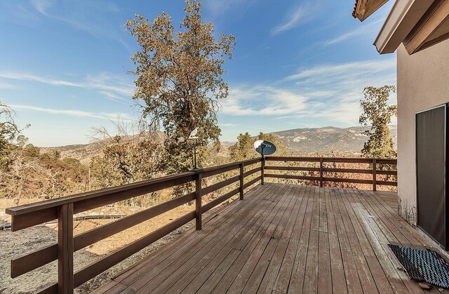 wooden terrace with a mountain view