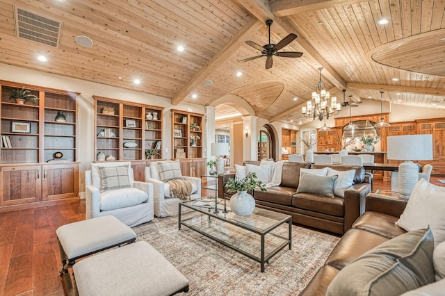 living room featuring ceiling fan with notable chandelier, wood-type flooring, beam ceiling, and wooden ceiling