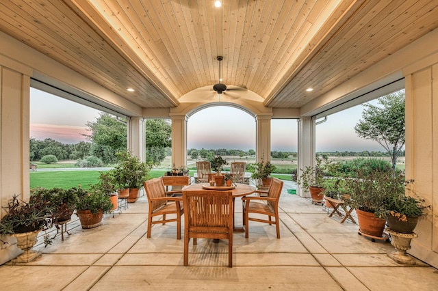 sunroom / solarium with wooden ceiling and ceiling fan