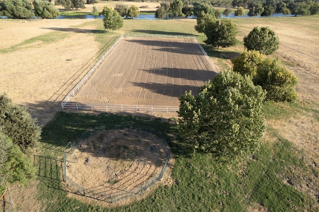 birds eye view of property featuring a water view and a rural view