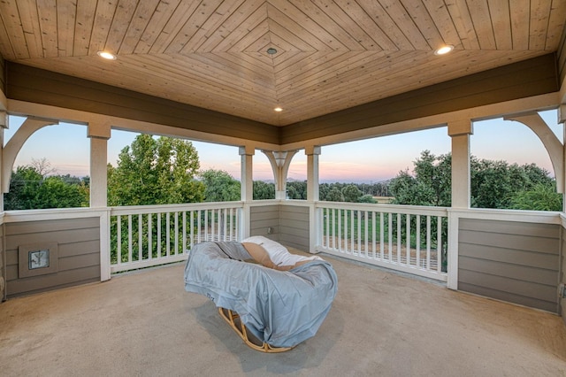 view of patio terrace at dusk