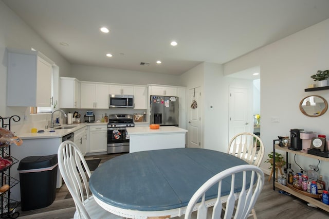 dining room featuring dark hardwood / wood-style floors and sink