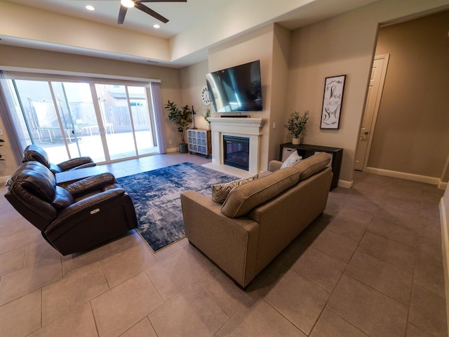 living room featuring tile patterned flooring and ceiling fan