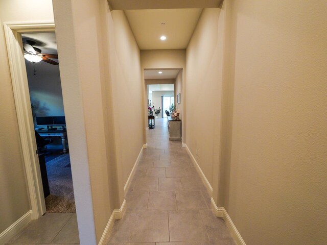 corridor with light tile patterned floors