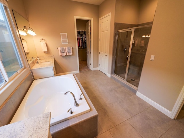 bathroom with vanity, tile patterned flooring, and independent shower and bath