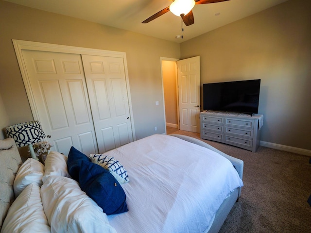 carpeted bedroom with a closet and ceiling fan