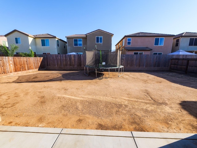 view of yard with a trampoline