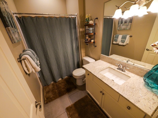 bathroom featuring tile patterned floors, toilet, a chandelier, vanity, and curtained shower