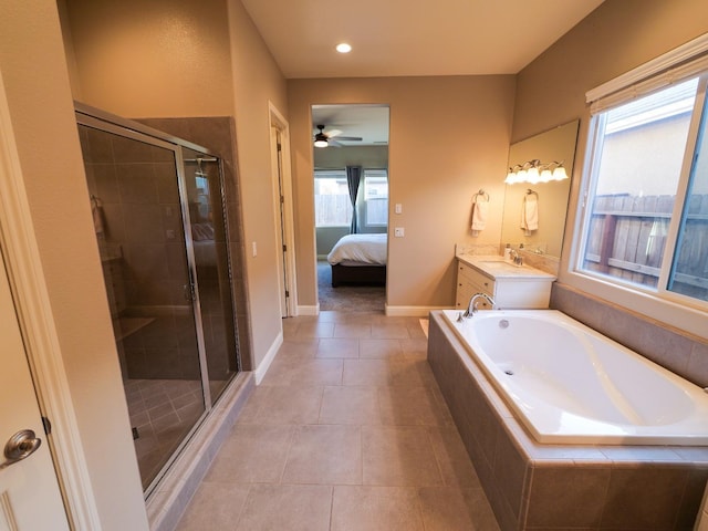 bathroom with vanity, tile patterned floors, and plus walk in shower