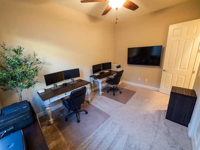 carpeted home office with ceiling fan