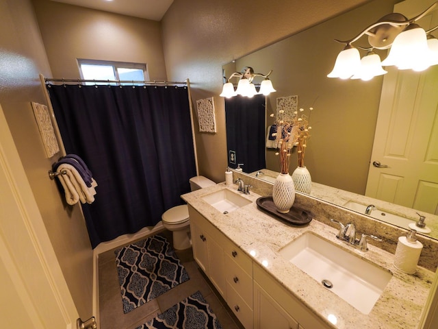 bathroom featuring walk in shower, vanity, toilet, and tile patterned flooring