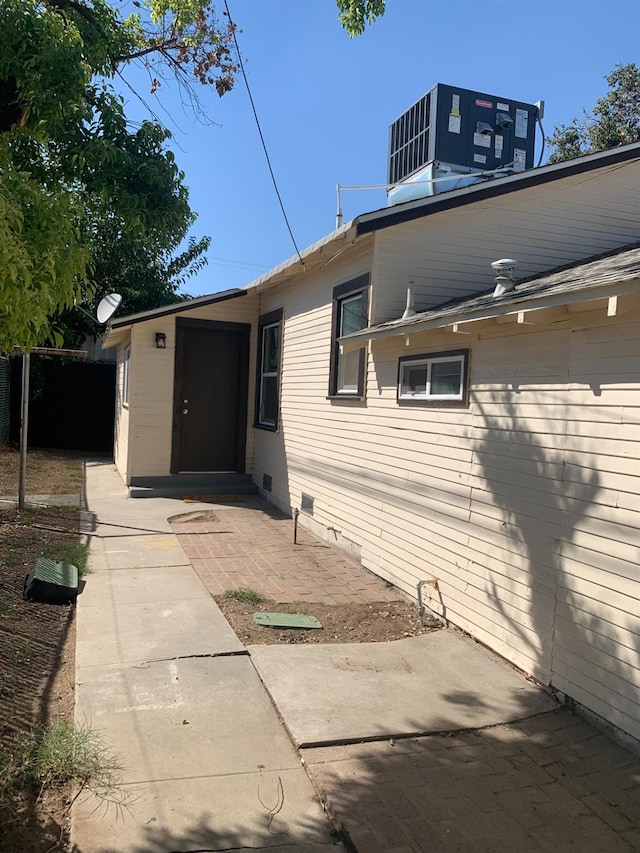 view of property exterior featuring a patio area and central air condition unit