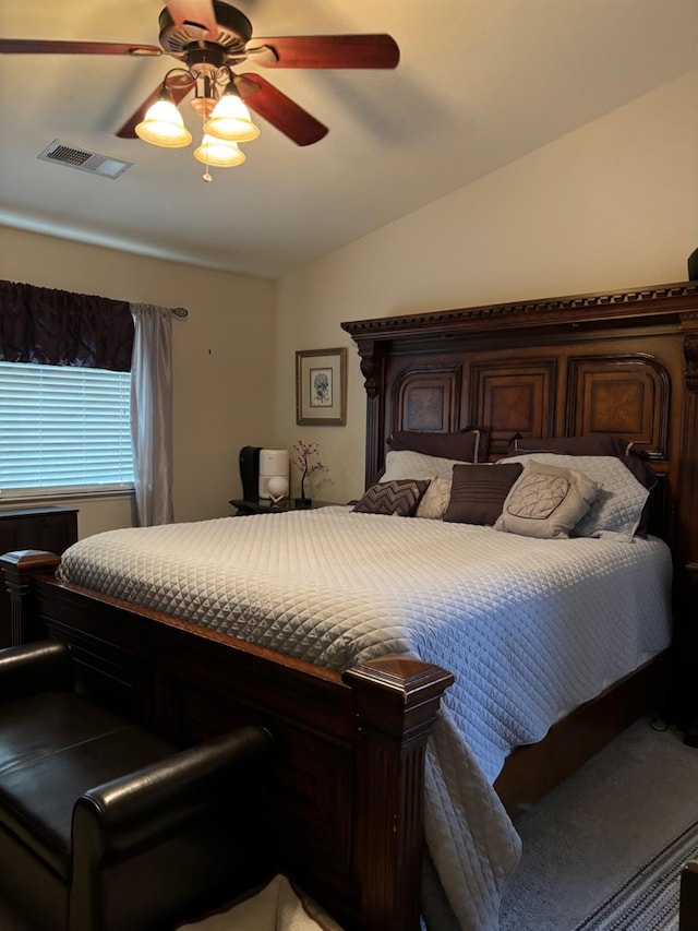 bedroom featuring ceiling fan and vaulted ceiling