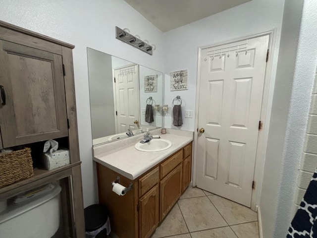 bathroom featuring vanity, toilet, and tile patterned floors