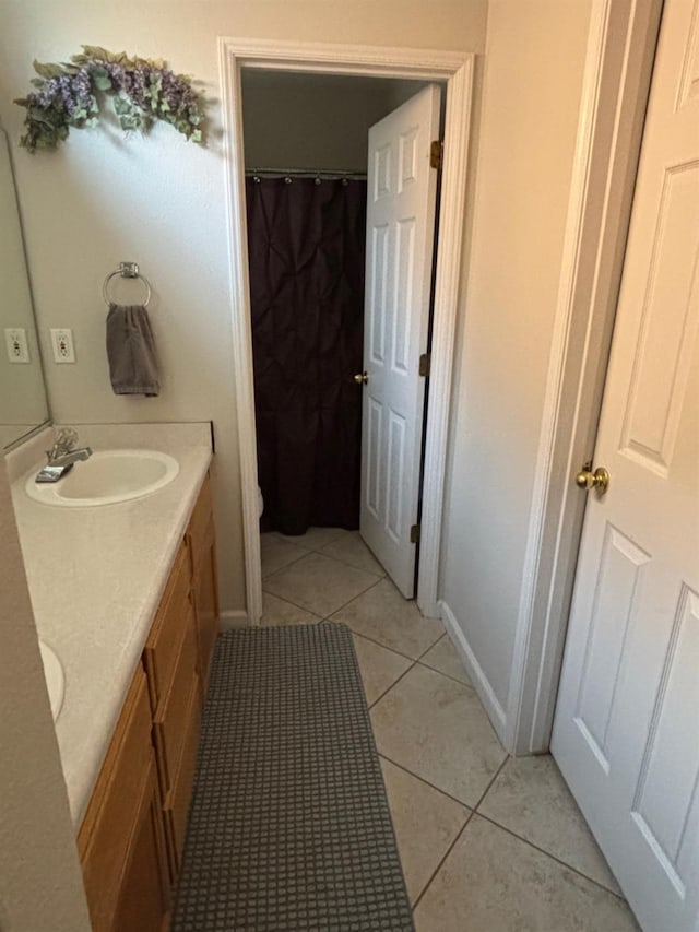 bathroom with vanity and tile patterned floors