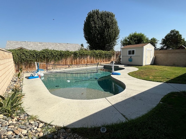 view of swimming pool with a storage unit