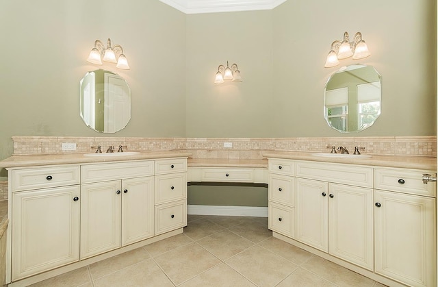 bathroom featuring vanity, crown molding, and tile patterned floors