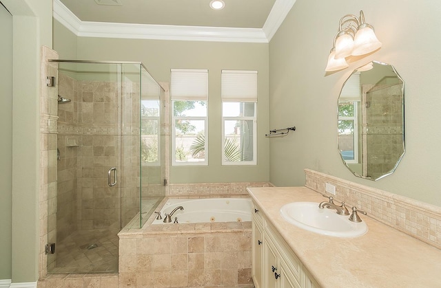 full bath featuring a whirlpool tub, a stall shower, ornamental molding, and vanity