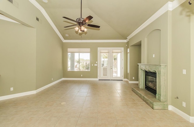 unfurnished living room featuring visible vents, a premium fireplace, light tile patterned flooring, vaulted ceiling, and baseboards