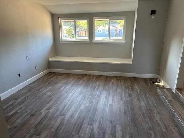 unfurnished room featuring dark hardwood / wood-style floors