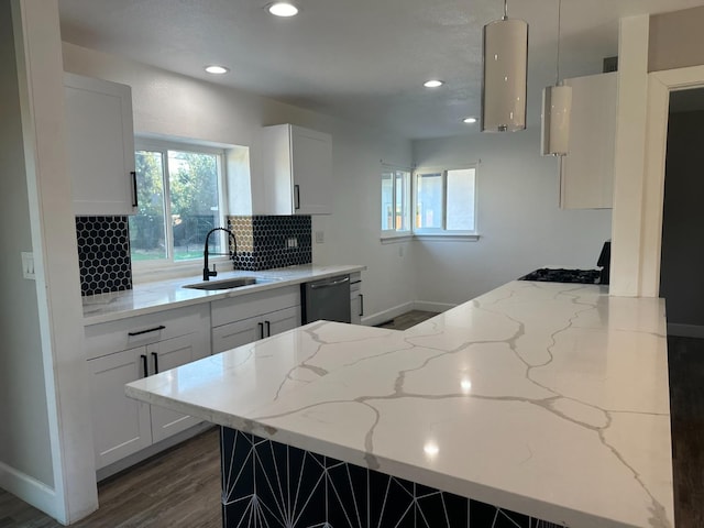 kitchen with dishwasher, dark hardwood / wood-style flooring, white cabinetry, and sink