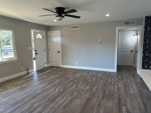 entrance foyer featuring ceiling fan and dark wood-type flooring