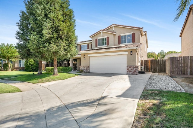 view of front property featuring a garage and a front yard