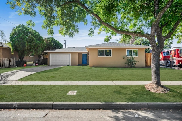 view of front of property featuring a garage and a front yard