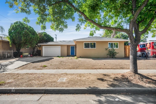 ranch-style house featuring a garage