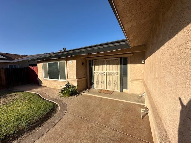 property entrance with a patio area