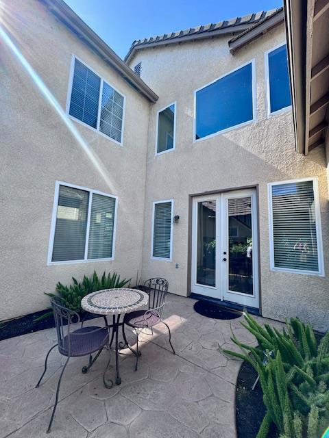 4707 N Arrow Ridge Way N, Clovis, CA 93619 - view of patio / terrace featuring french doors and outdoor dining space