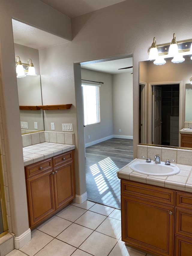 4707 N Arrow Ridge Way N, Clovis, CA 93619 - full bathroom with vanity, baseboards, and tile patterned floors
