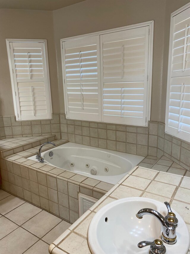 4707 N Arrow Ridge Way N, Clovis, CA 93619 - full bath with a sink, a tub with jets, and tile patterned flooring