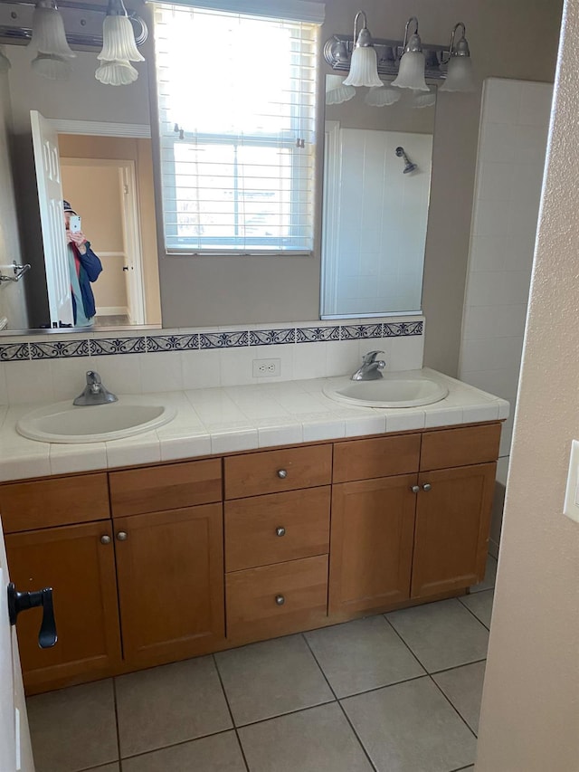 4707 N Arrow Ridge Way N, Clovis, CA 93619 - bathroom with double vanity, tile patterned flooring, and a shower