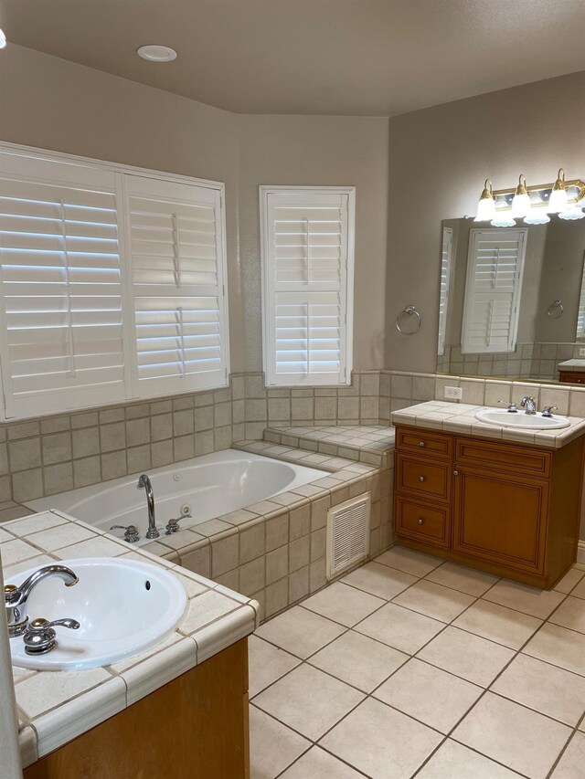 4707 N Arrow Ridge Way N, Clovis, CA 93619 - bathroom with vanity, a tub with jets, and tile patterned flooring