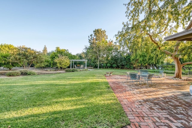 view of yard featuring a pergola and a patio