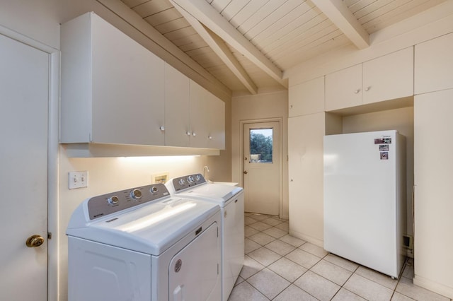 washroom featuring light tile patterned floors, cabinets, washer and dryer, and wooden ceiling