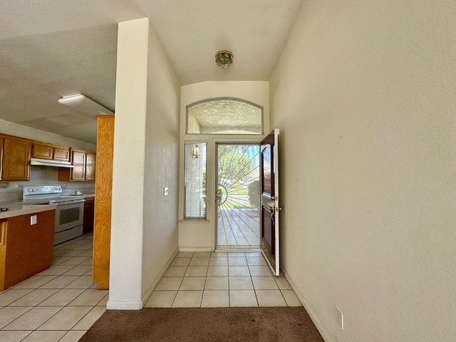 tiled foyer with a textured ceiling