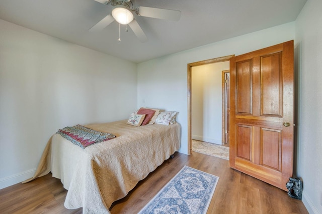 bedroom featuring wood-type flooring and ceiling fan