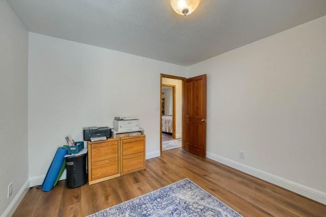 office space with hardwood / wood-style floors