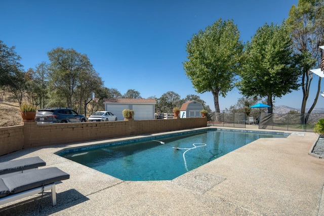 view of swimming pool with a patio area