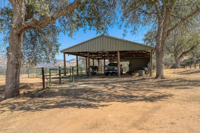 view of outbuilding featuring a mountain view