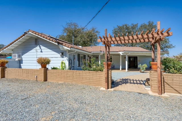 view of front of property featuring a patio