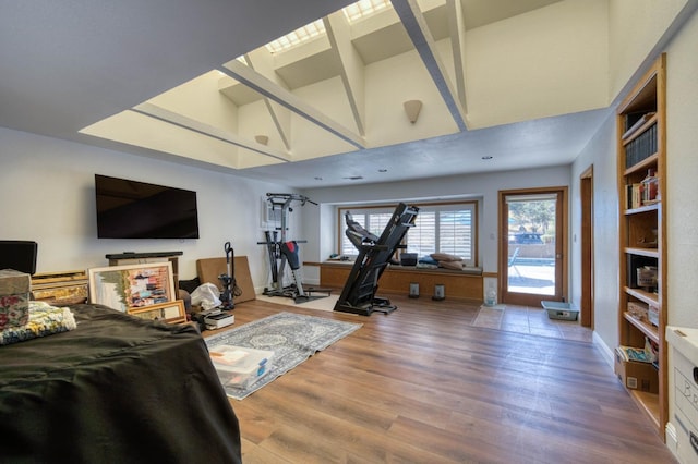 living room featuring hardwood / wood-style floors and high vaulted ceiling